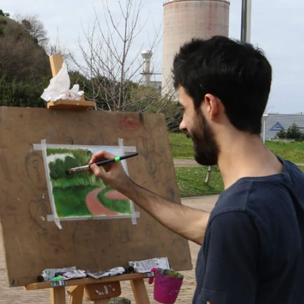 DigiPen Europe-Bilbao students painting at easels in a park