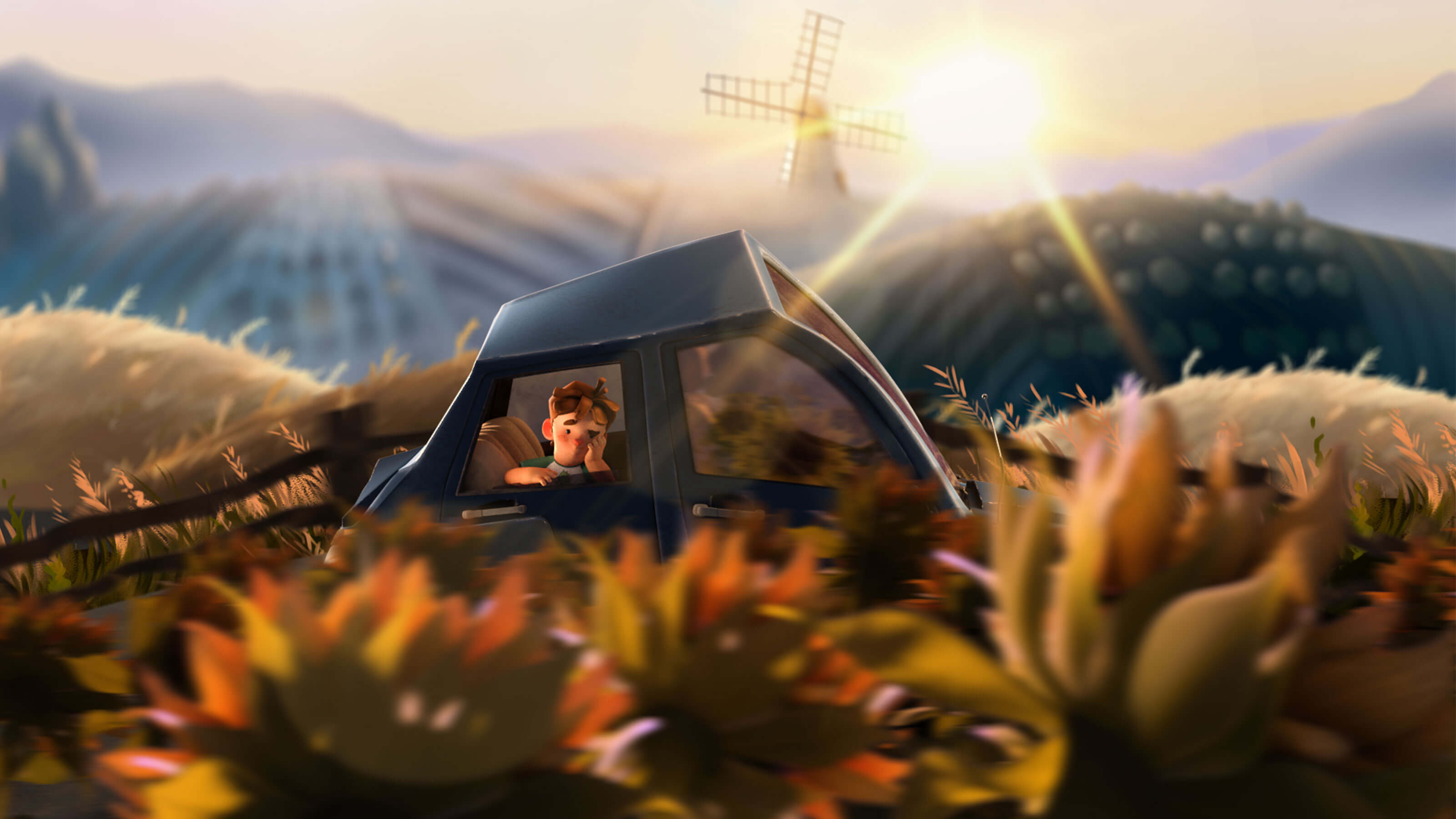 A bored boy looks out the window of a car that&#039;s passing through a series of hills with a windmill in the background