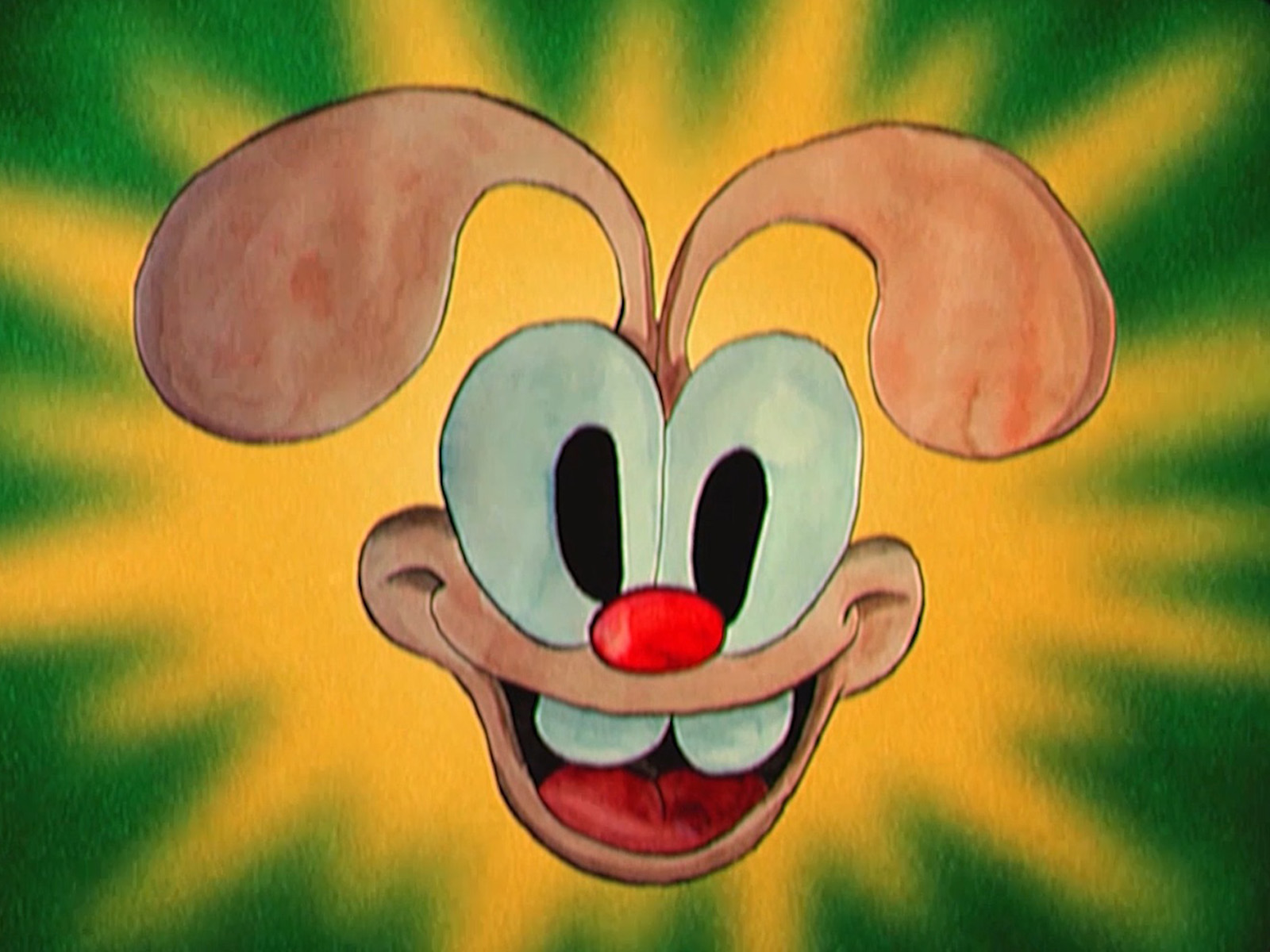 A look at the face of Conej, the main bunny character, surrounded by green and yellow light