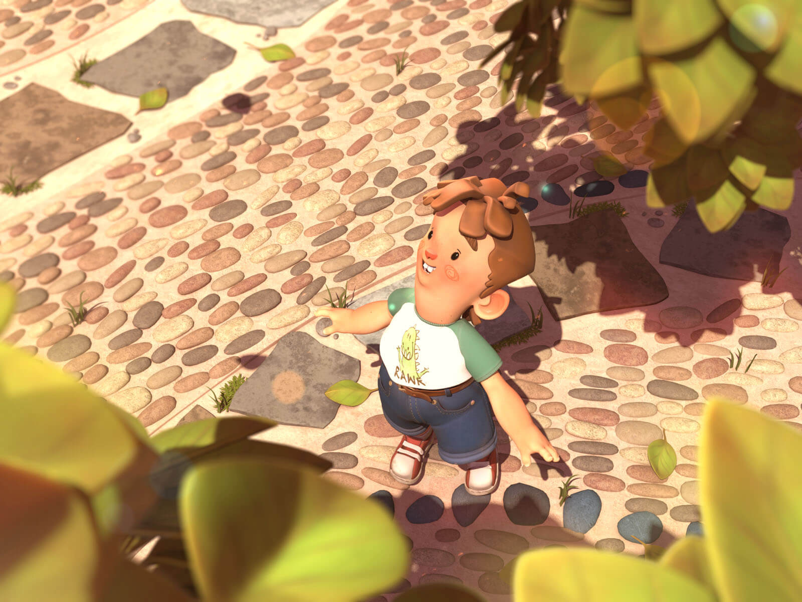 A boy stands on a cobblestone path and looks up beyond the leaves