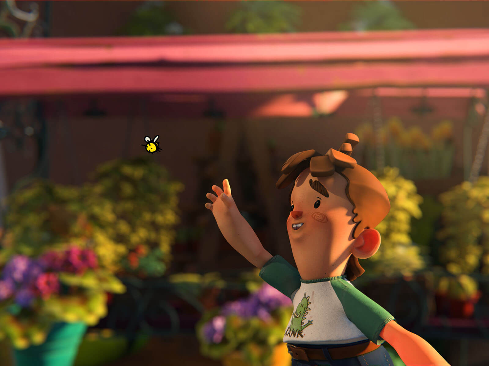 Un niño persigue una abeja frente a un lugar lleno de flora y flores.