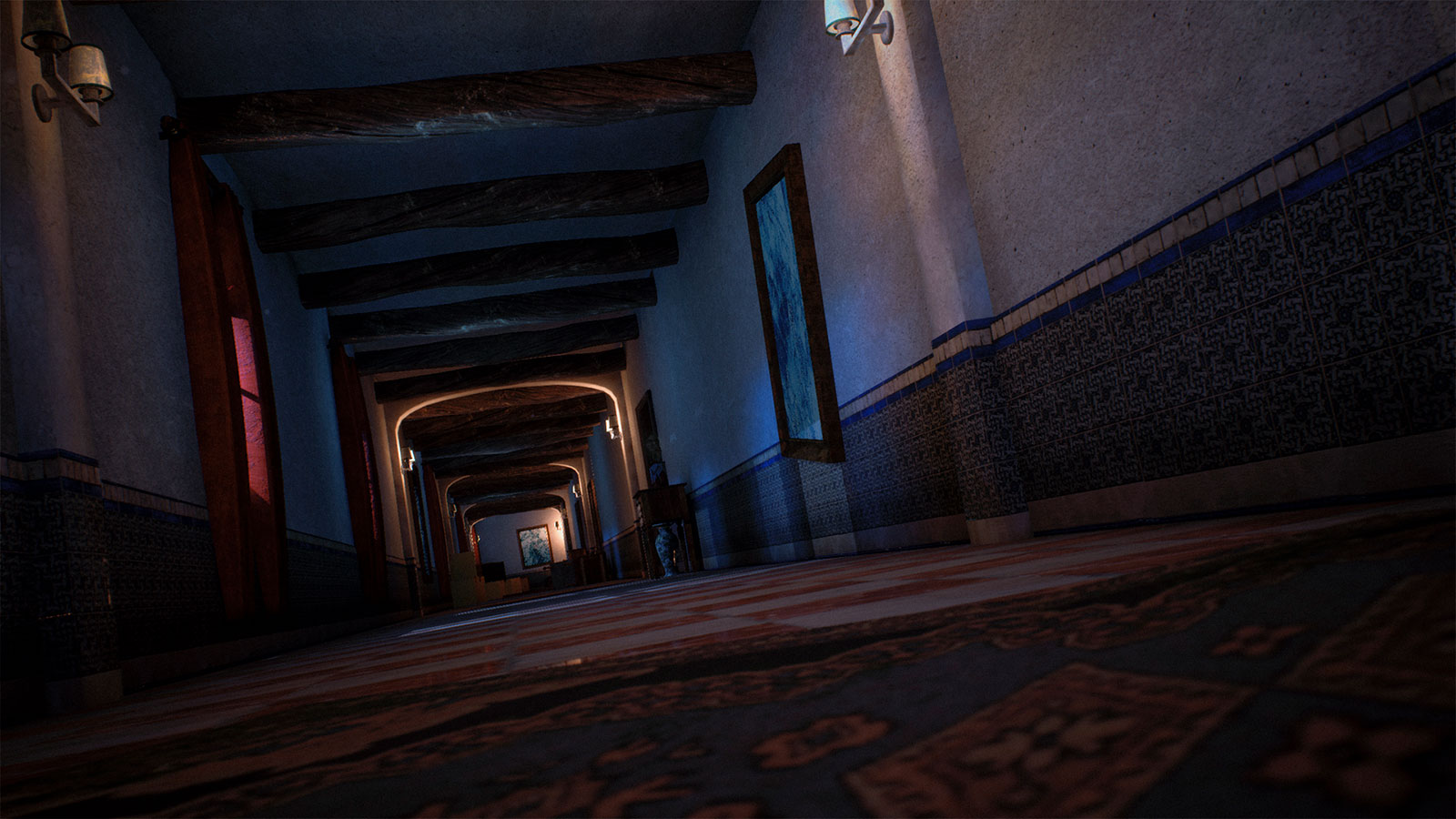 A low-angle shot of a long lavish dimly-lit hallway