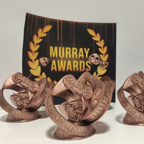 Five Murray Awards stand in front of the official Murray Awards logo
