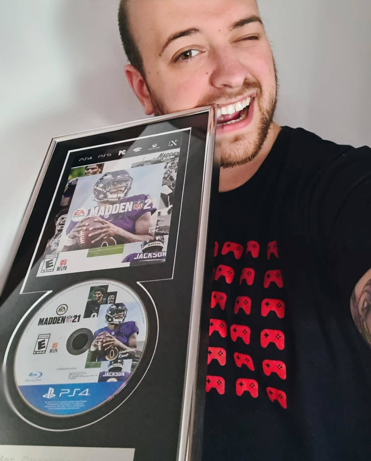 Ander Guerrero holding onto a Madden 2021 plaque