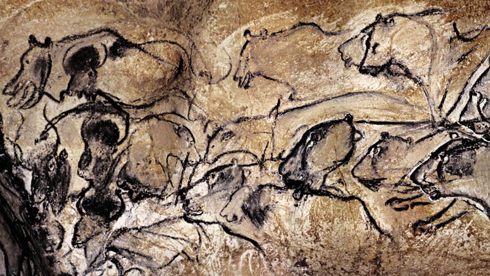 A cave painting depicting a group of animals.